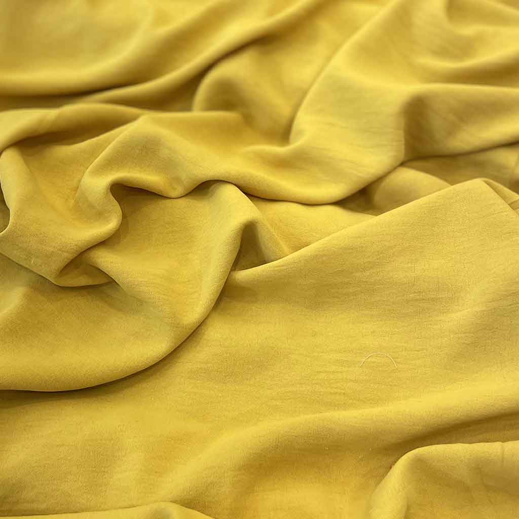 پارچه ابر و بادی ساده زرد