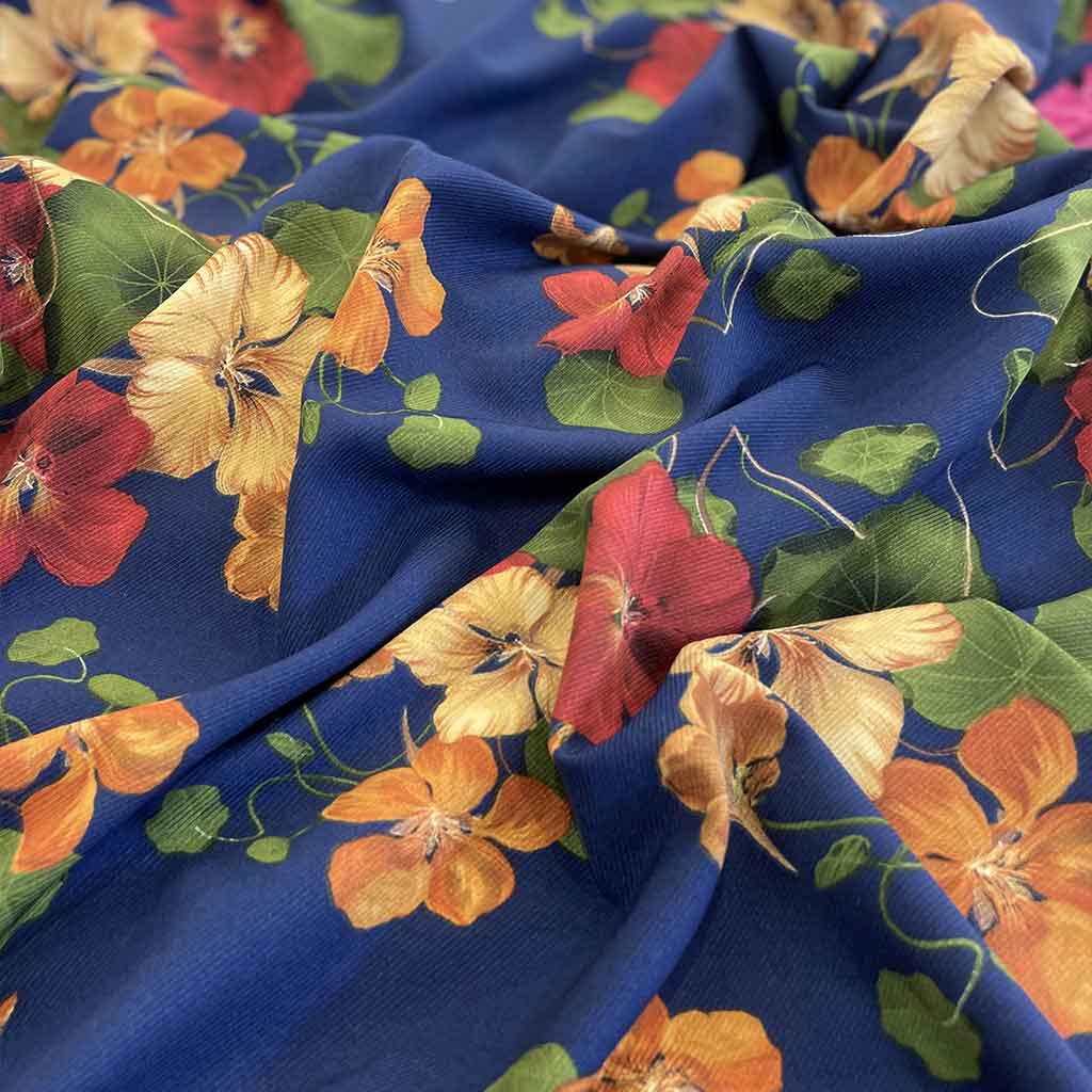 پارچه نخی آبی طرح گل رنگی