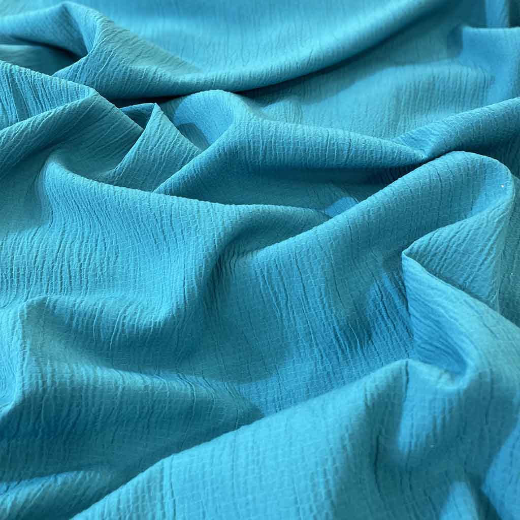 پارچه نخی ساده رنگی آبی فیروزه ای