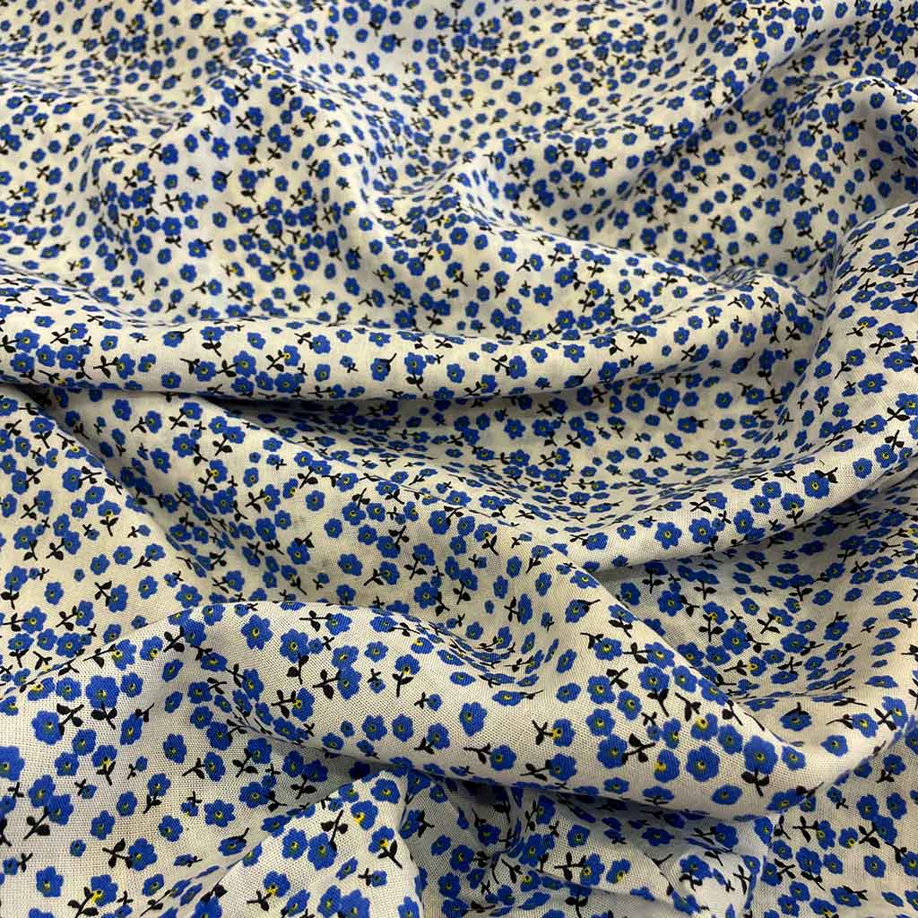 پارچه نخی طرحدار گل ریز آبی